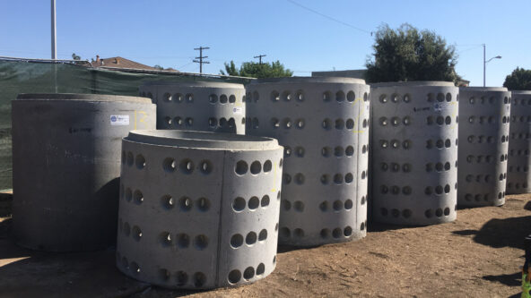 photo of drywell pipe sections waiting to be installed below ground; drilled holes allow water to soak into the soil and recharge groundwater supplies | credit Los Angeles County Department of Public Works | Los Angeles, CA