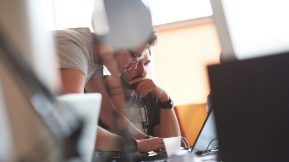 photo of people working together in an office setting