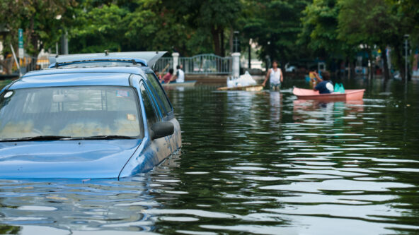 photo flood water submerges hood of a parked car