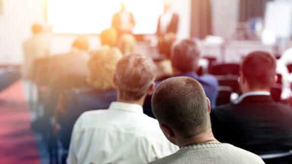 photo meeting room with people listening to presentation