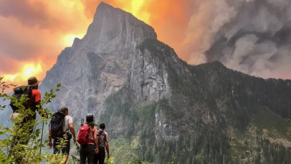 photo Merchant Peak climbers watching the Bolt Creek Fire over Baring Mountain on 9/10/2022 | credit Alison Dempsey-Hall | source Seattle Times