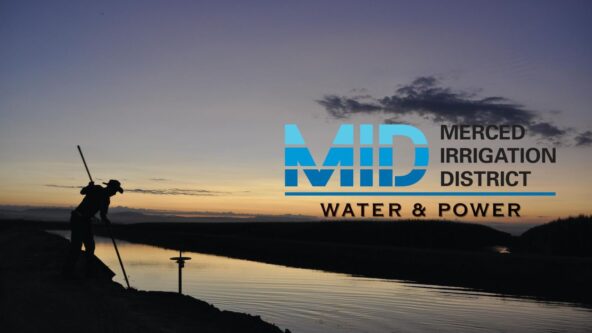 photo ditch rider silhouette at an irrigation channel at sunset | source Merced Irrigation District