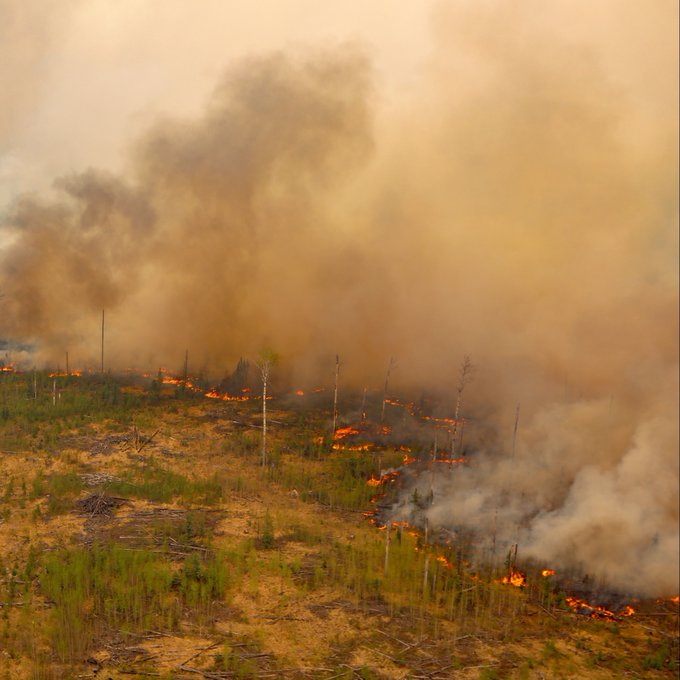 photo of billowing smoky clouds and an active wildland fire in the Canadian province of Alberta, posted by Alberta Wildfire on twitter on May 19, 2023