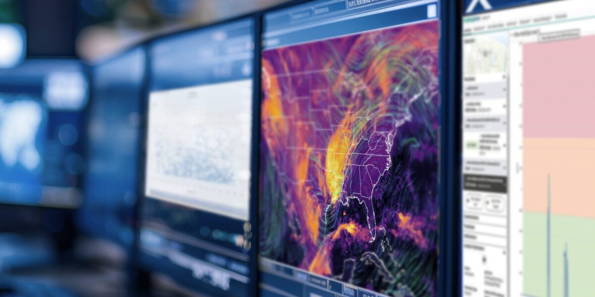 photo from an emergency management command center; image shows multiple computer monitors. screens display map of hail forecasts, estimated size of hailstones and distribution of historical hailstone impacts | source AdobeStock 790001458 purchased and modified