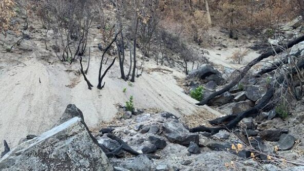 photo of post-fire debris flow, 2021 Dixie Fire in Northern California | credit USGS public domain